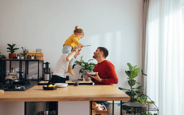istock Family Playing While Having a Healthy Breakfast in the Kitchen 1356820243