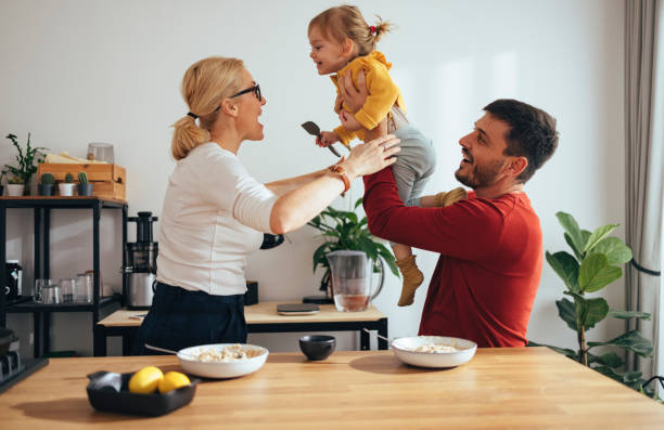 istock Family Playing While Having a Healthy Breakfast in the Kitchen 1356820252