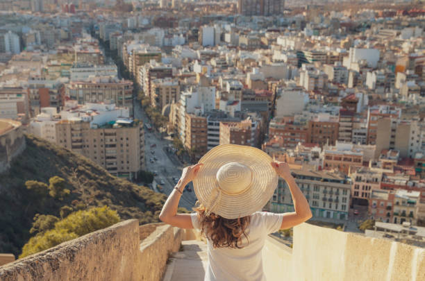 istock woman looking at city view panoramic 1356820412