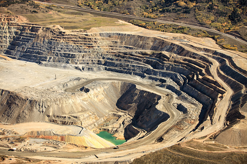 An aerial view of the dikes and excavation at an open pit copper mine in Butte Montana.