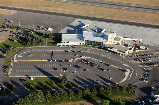 An aerial view of the Idaho Falls regional airport terminal and tower.
