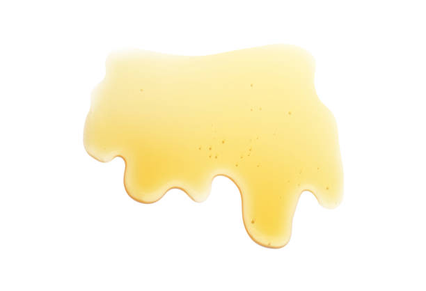 istock Dripping honey isolated on white background. Golden and flowing. 1356825282