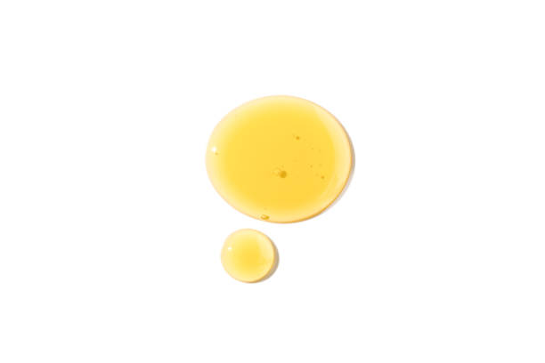 istock Honey drops isolated on white background. Top view. 1356825283