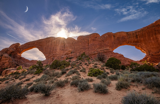 Beautiful Sunrise Reflecting On The Red Sandstone At Wilson Arch, Near Moab, Utah