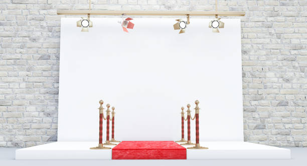 istock Photography studio with red carpet and barrier, photo studio with lighting equipment 1356827496
