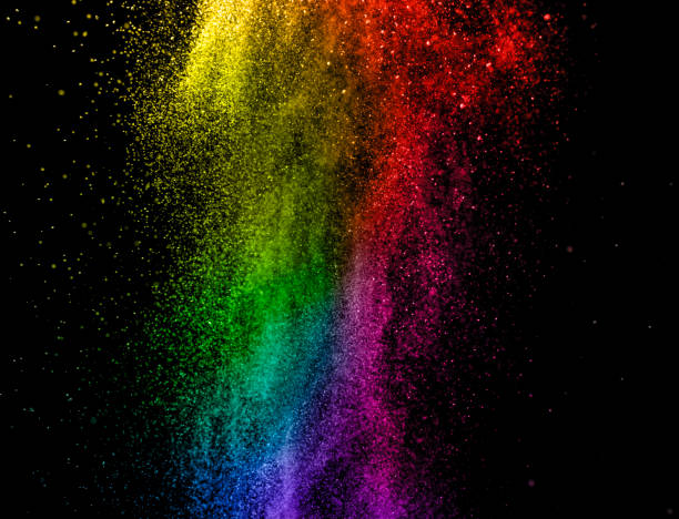 Color powder splash explosion on black background. Abstract multicolor tint rainbow design.