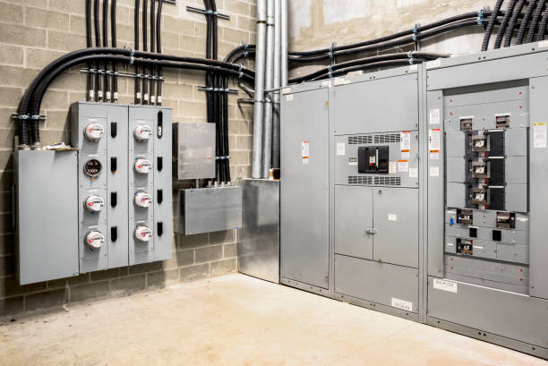 Electrical room of residential or commercial building. Multiple smart meters, main power breaker, meter stacks and cabinets. Perspective view. transformer stock pictures, royalty-free photos & images