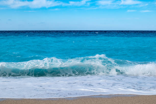 istock Azure breaker waves on beach, island in Greece 1356829484