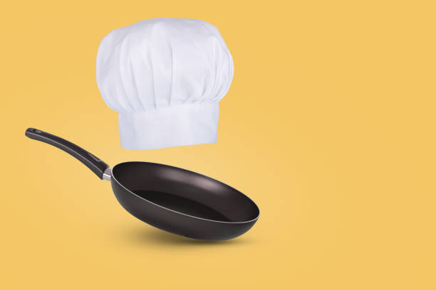 istock Chef hat floating in air isolated on a blue background. Creative business concept. 1356830291