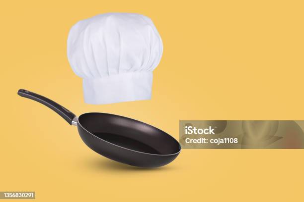 Chef Hat Floating In Air Isolated On A Blue Background Creative Business Concept Stock Photo - Download Image Now
