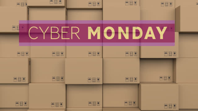 Animation of cyber monday text over stack of cardboard boxes in warehouse