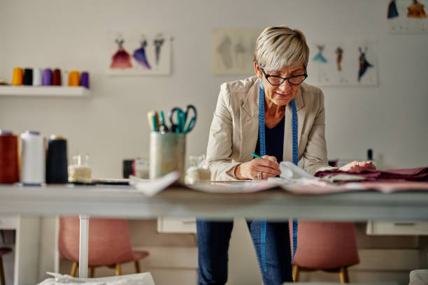 istock Senior woman working in atelier 1356833392