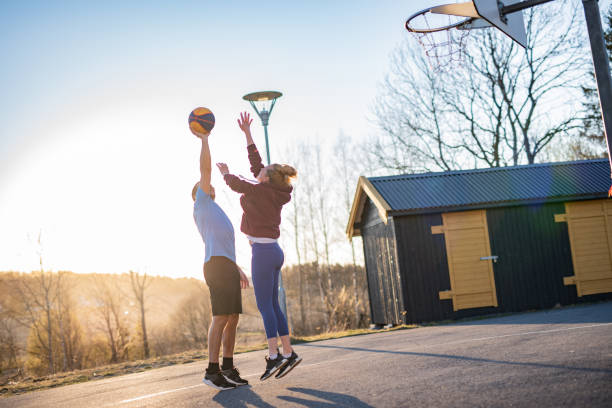 istock Couple playing basketball 1356834132