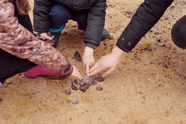 istock Children explore rocks and minerals in the sand 1356834163