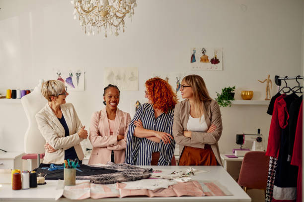 istock Four multiracial fashion designers in studio 1356834490