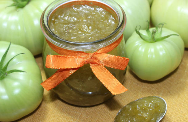 istock glass with marmalade with green tomatoes 1356836200