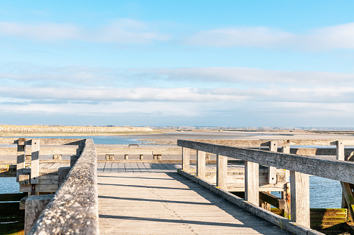 Footbridge with view on sea, in Le Crotoy, Baie de Somme in France.