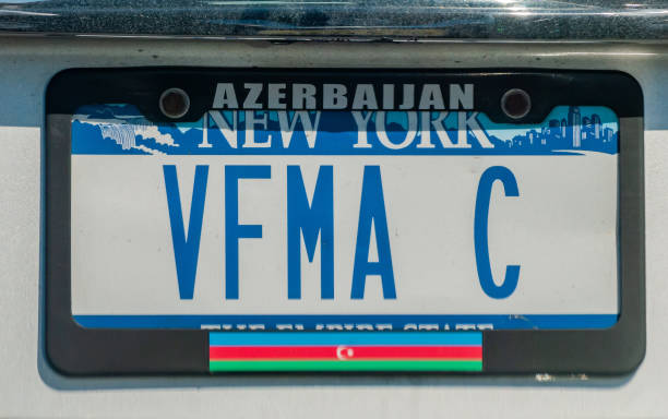 A New York license plate with the word "Azerbaijan" and a flag of the Republic of Azerbaijan. New York City, New York, United States of America  - September 22, 2016. A New York license plate with the word "Azerbaijan" and a flag of the Republic of Azerbaijan. new york state license plate stock pictures, royalty-free photos & images