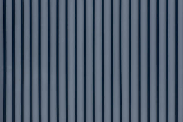 istock weathered metal siding fence background 1356837176