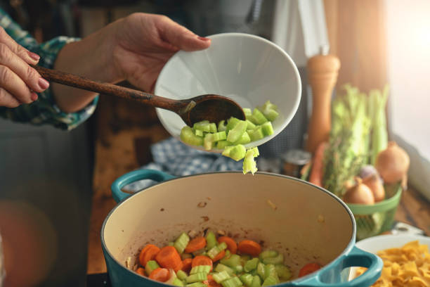 Preparing Chicken Noodles Soup with Fresh Vegetables