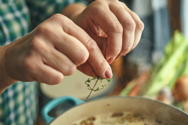 istock Preparing Chicken Noodles Soup with Fresh Vegetables 1356837718