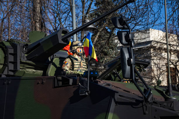 1st of December parade for the National Day of Romania Bucharest, Romania - 01.12.2021: 1st of December parade for the National Day of Romania  - soldiers in military vehicles of the romanian army tank musician stock pictures, royalty-free photos & images