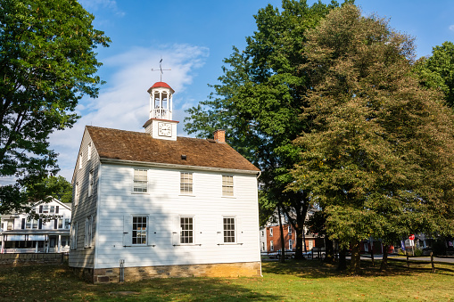 Ephrata, Pennsylvania, United States of America - September 9, 2016. The Academy building of Ephrata Cloister in Ephrata, PA. The Academy was opened by the Householders in 1837 as a private school for their children. Exterior view with vegetation.