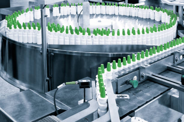 istock Close-up Many white plastic spray bottles for packaging liquid medicines or cosmetics in a row on a conveyor belt in a pharmaceutical manufacturing factory 1356838158