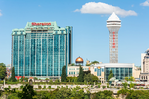 Niagara Falls, Ontario, Canada - September 12, 2016. Sheraton Hotel and Casino Tower buildings in Niagara Falls, ONT. View with surrounding buildings on a sunny day.