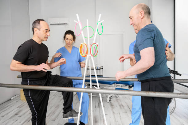 Group of People with disability exercising at rehabilitation clinic. High quality photo Group of People with disability exercising at rehabilitation clinic. High quality photo rehabilitation center near me stock pictures, royalty-free photos & images