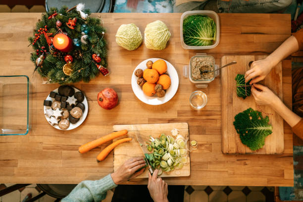 istock Female hands preparing christmas dinner at table 1356840719