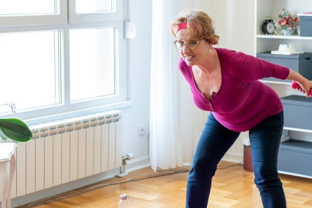 istock Senior woman home exercise 1356843042