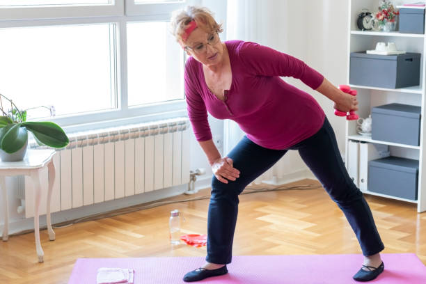istock Senior woman home exercise 1356843171