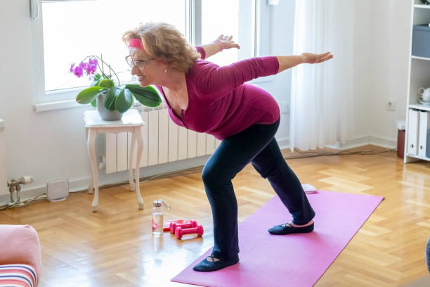 istock Senior woman home exercise 1356843279