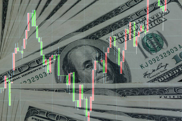 istock Stock quotes graphs and American dollar bill 1356844172