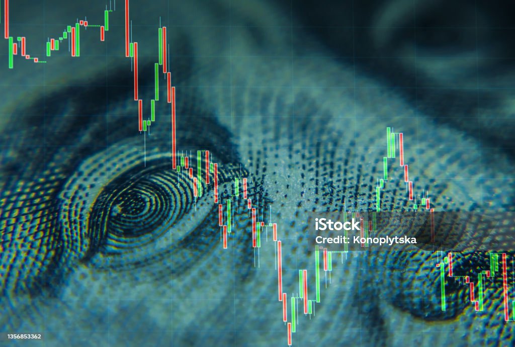 Stock quotes graphs and American dollar bill Hundred-dollar bills of American dollars and a portrait of Benjamin Franklin against the background of the dynamics of exchange quotations. Effective investment, business and finance concept Economy Stock Photo