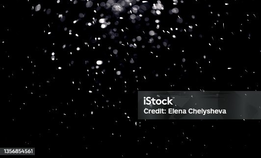 istock texture of falling snow, layer to overlay on a black background 1356854561