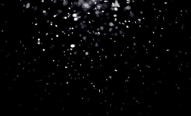 texture of falling snow, layer to overlay on a black background texture of falling snow, layer to overlay on a black background glowworm photos stock pictures, royalty-free photos & images