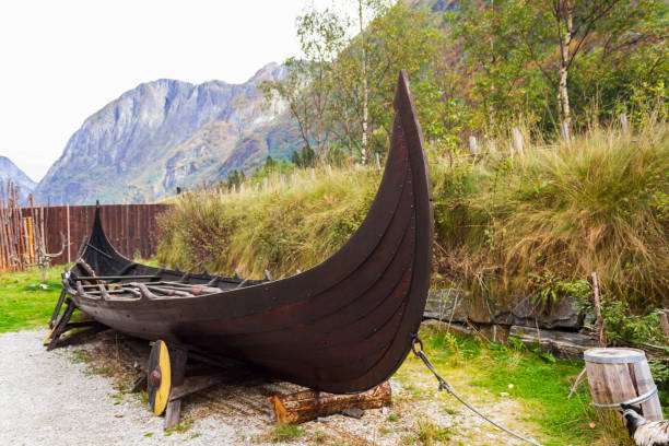 istock Viking ship with mountains on the background 1356856218