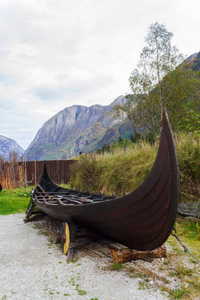 istock Viking ship with mountains on the background 1356856220