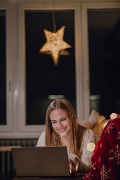 istock Enjoying in cozy night at home during winter 1356857201