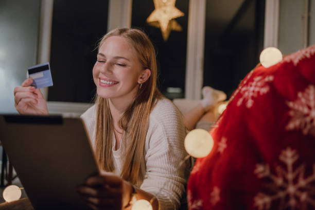istock Young woman using digital tablet and enjoying online shopping 1356857260