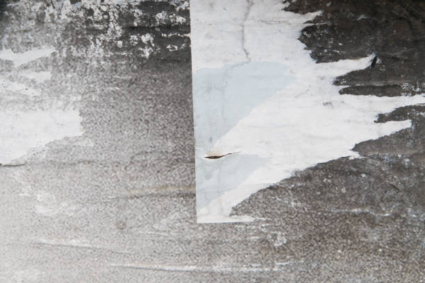 istock Weathered and ripped street poster background 1356862104