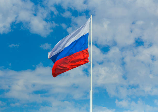 Flag of the Russian Federation Flag of the Russian Federation on the background of the sky russian flag stock pictures, royalty-free photos & images