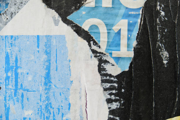 istock Weathered and torn street poster background 1356863647