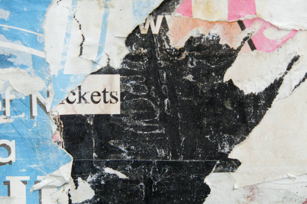 istock Weathered and torn street poster background 1356863694