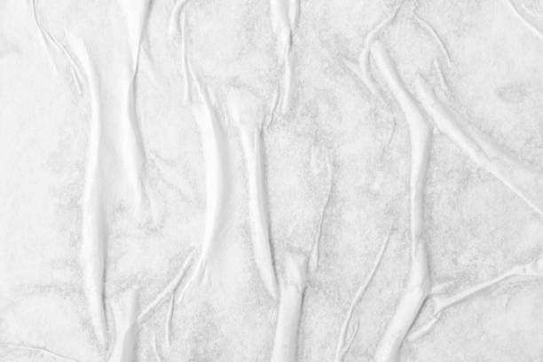 istock white crumpled and creased paper poster texture background 1356863748