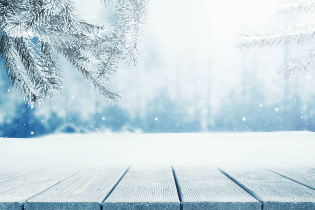 istock Winter Christmas scenic background with wooden table and copy space. 1356872191