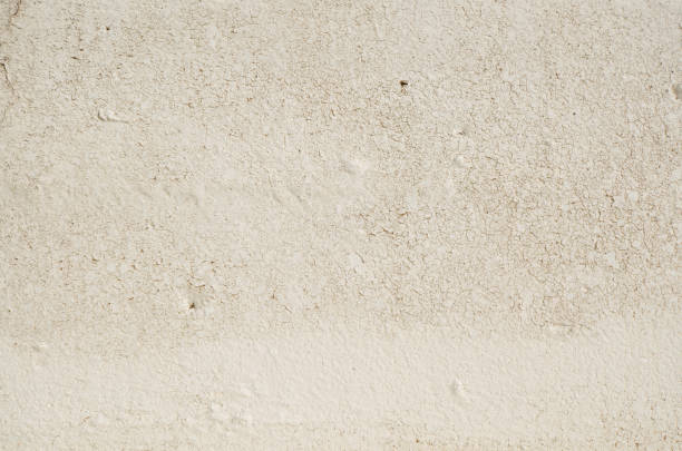 istock Old weathered concrete with cracked paint 1356874570