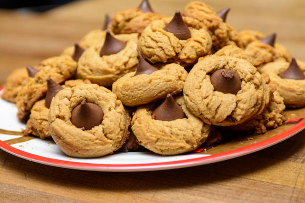 Pile of Peanut Butter Blossom cookies on a festive plate. stock photo